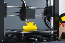 3D printer creating a small boat
